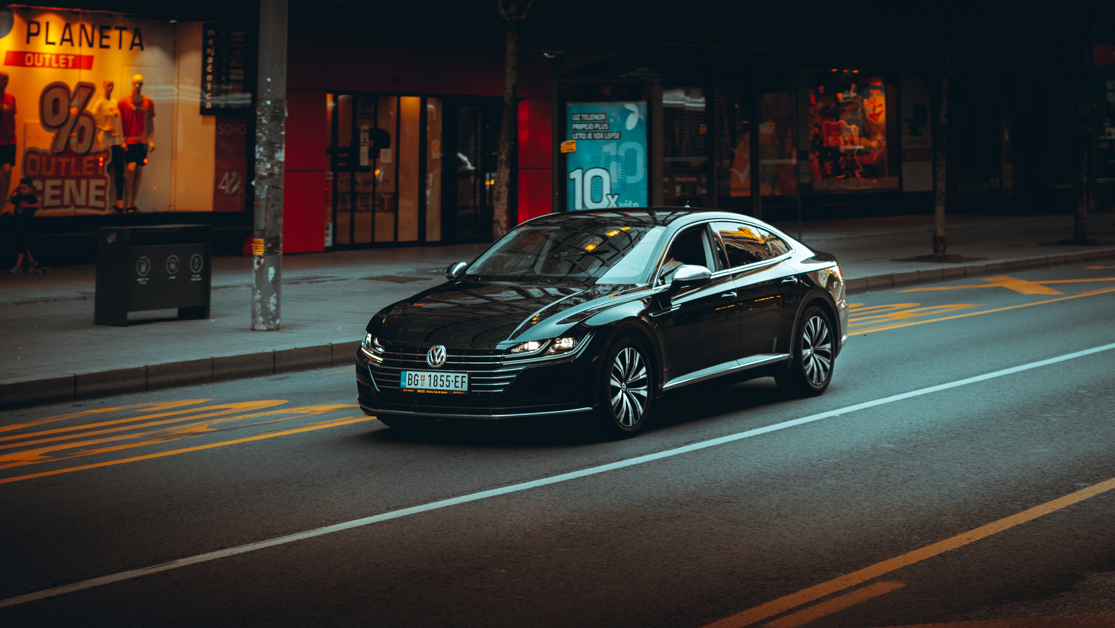 Black Sedan on Asphalt Road 